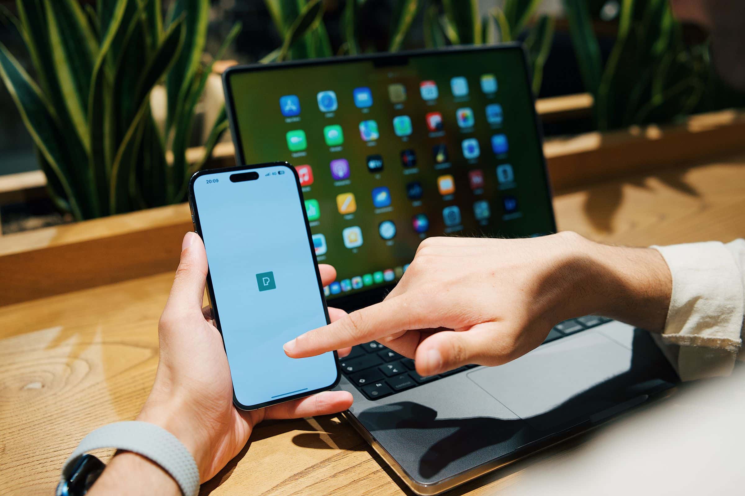 Entrepreneur reviewing a mobile app and its development cost on a laptop