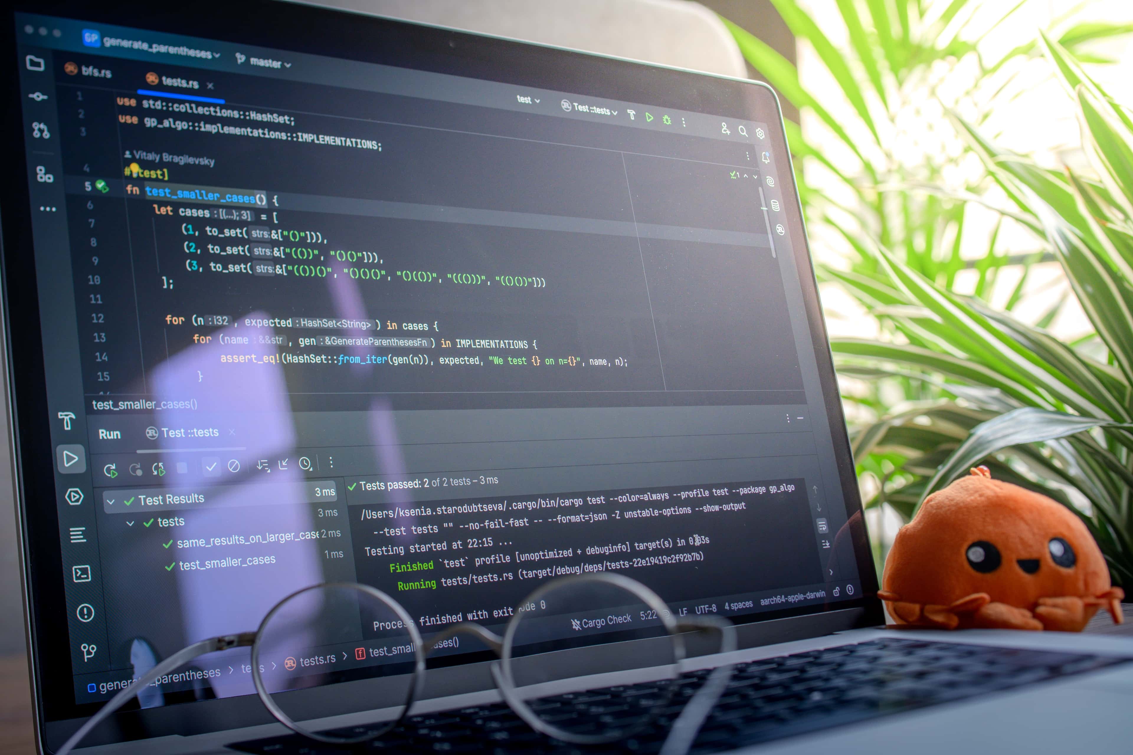 Laptop showing development tools for comparing custom software and no-code