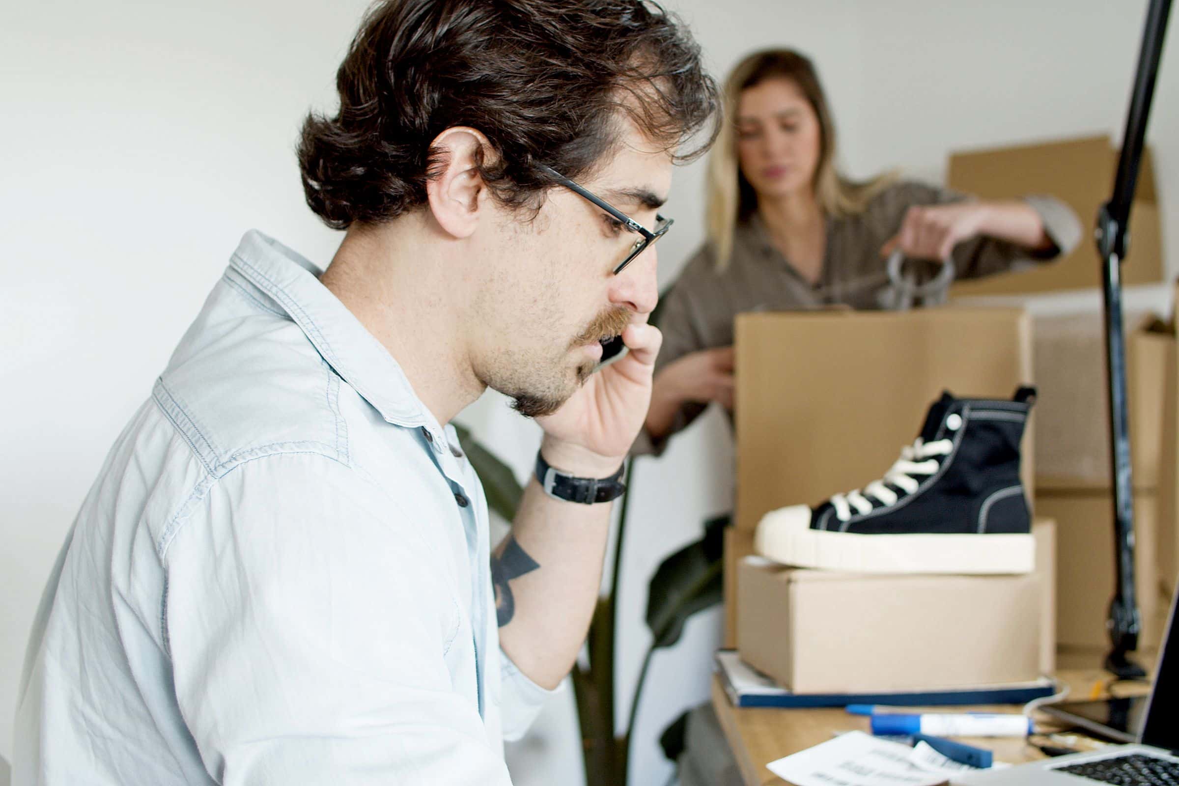Small business owners preparing ecommerce orders for customers in Oman
