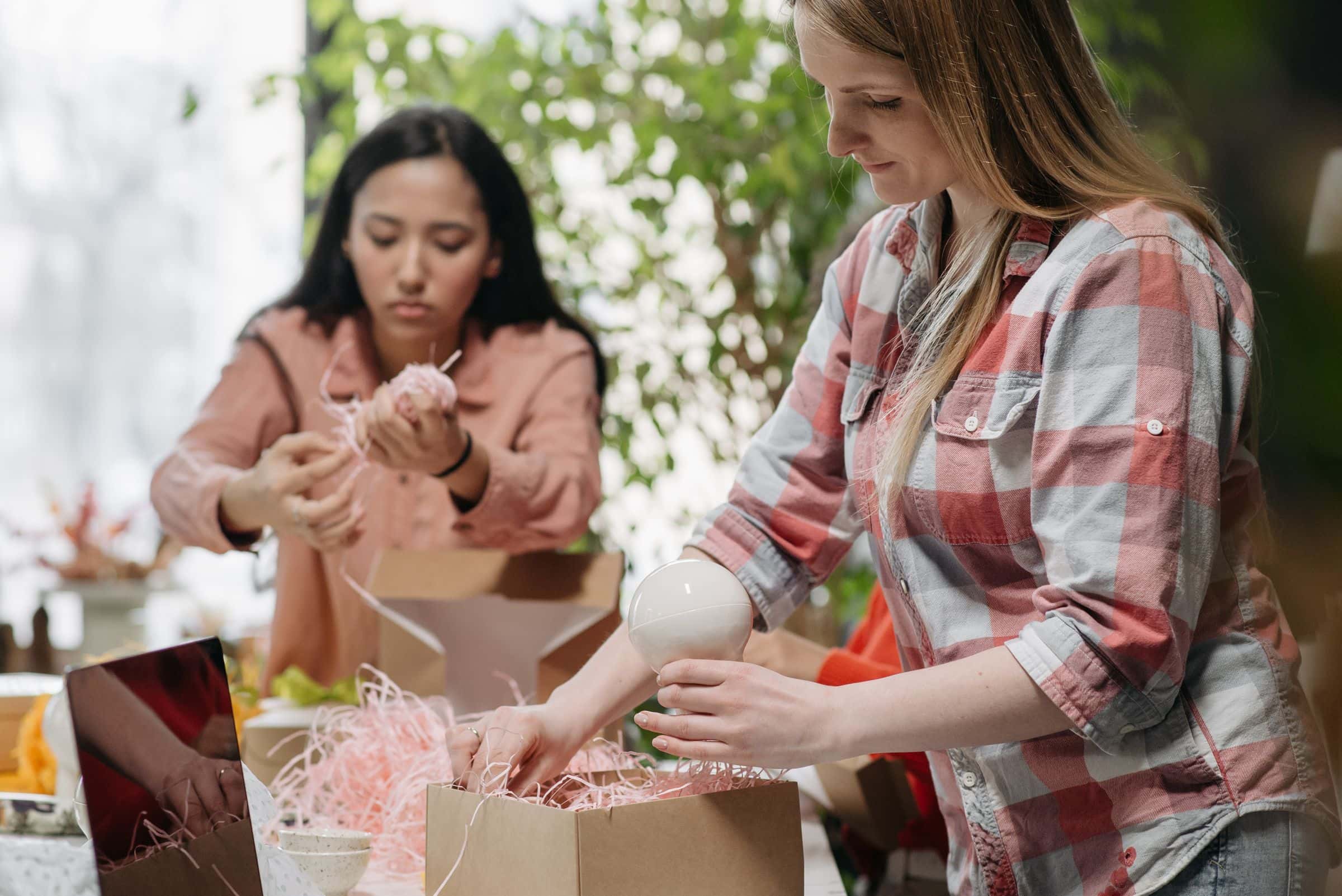 Small ecommerce team preparing first online orders for Saudi customers