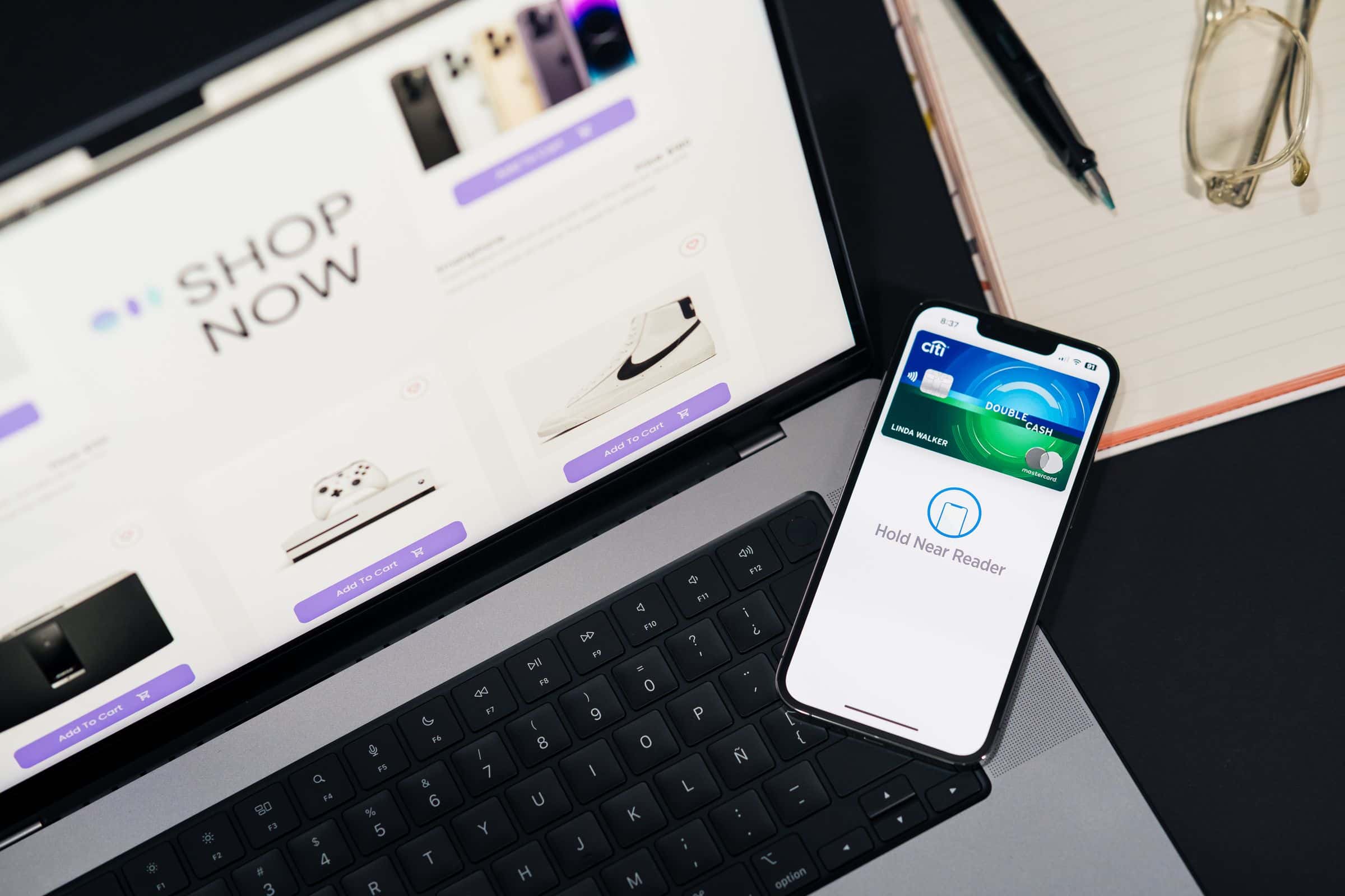 Phone and laptop showing digital payment for a Saudi online store