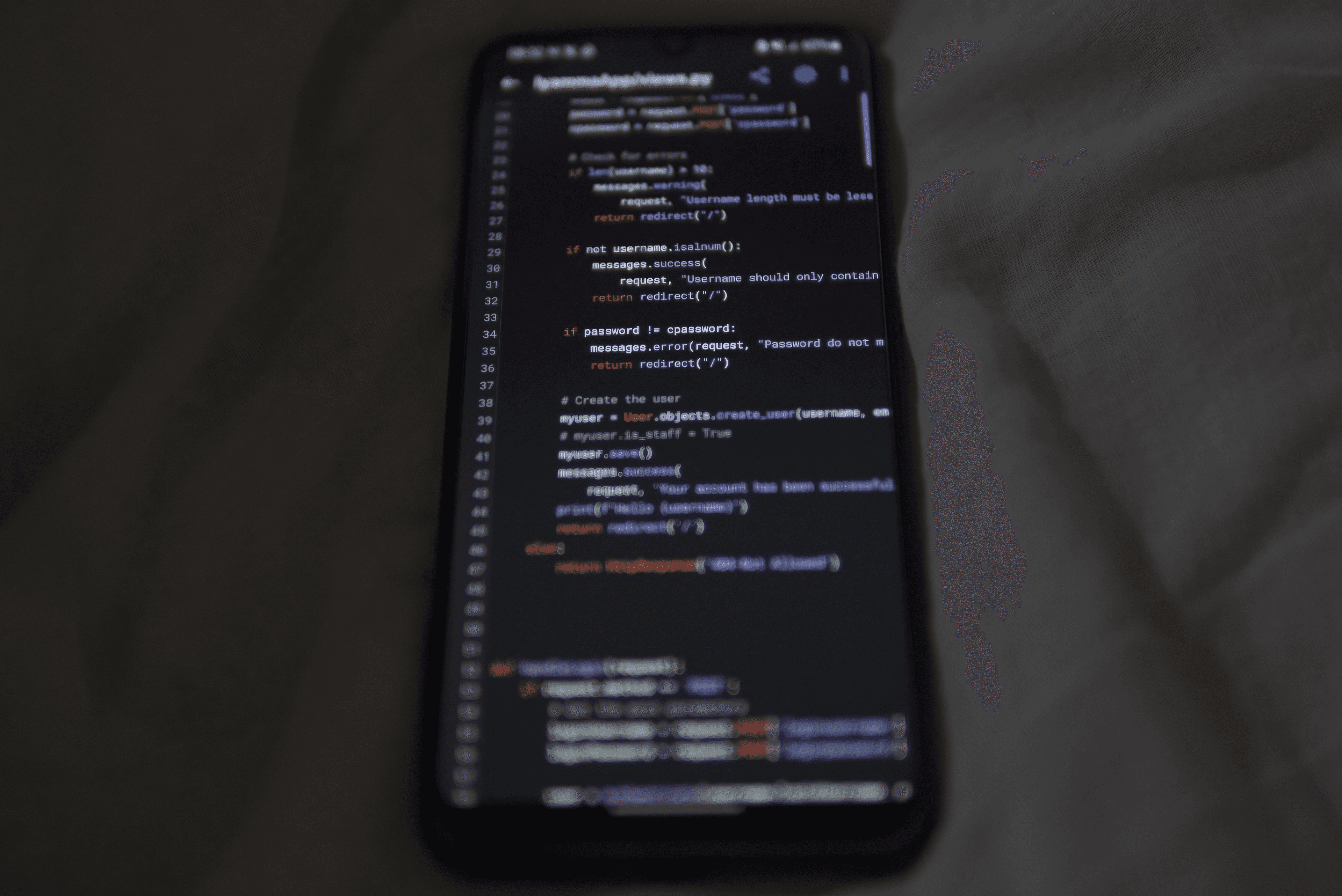 Smartphone displaying code for a mobile app technology decision