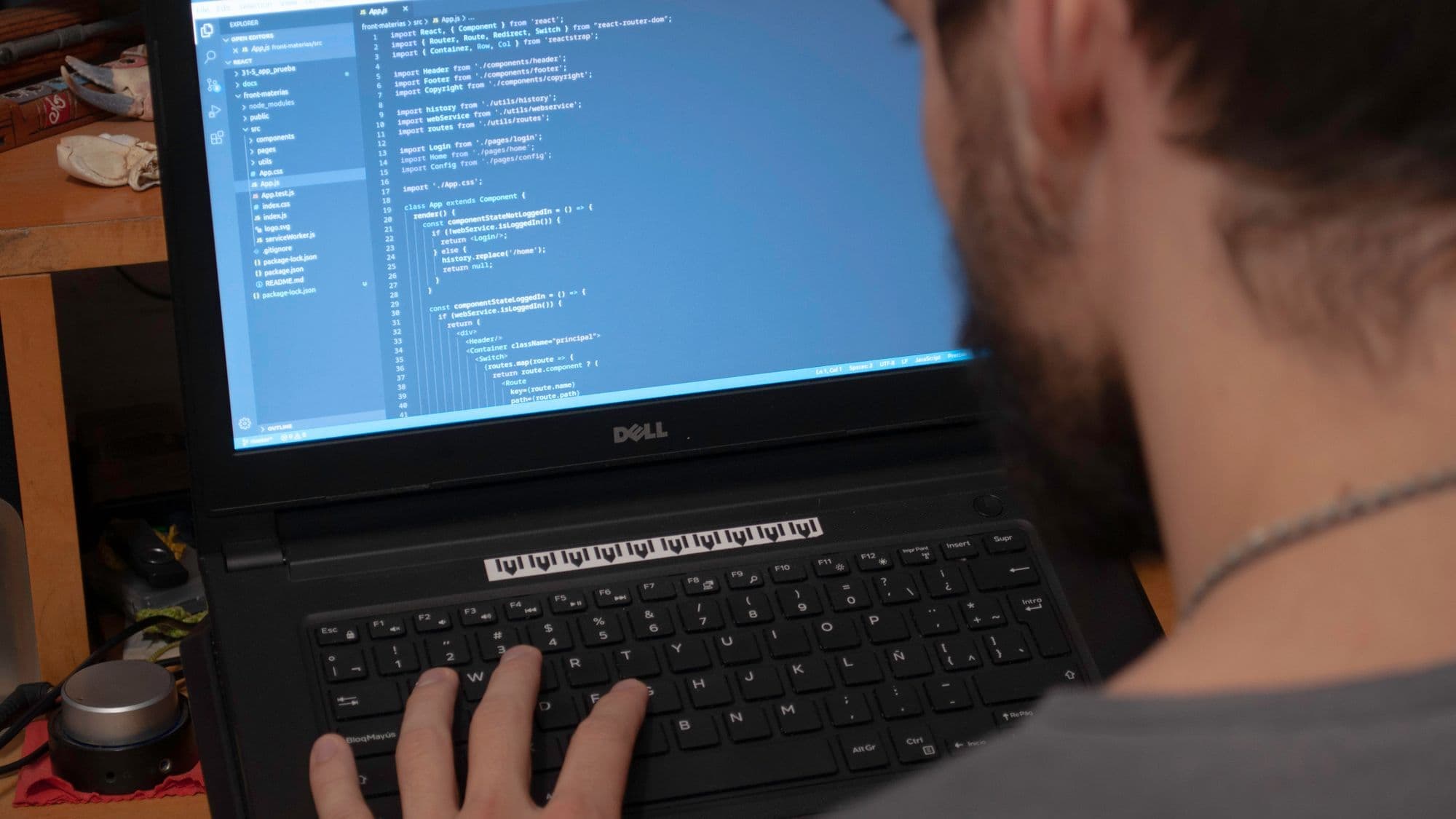 Developer working on a laptop representing a measurable AI pilot