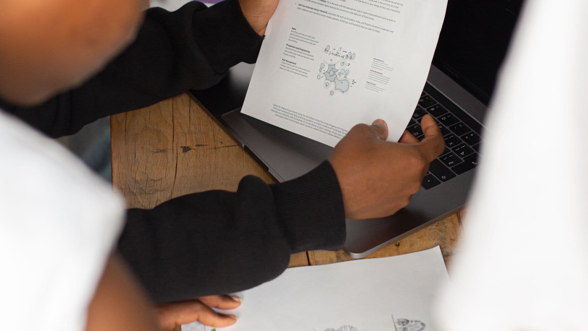 A construction team reviewing plans and request-for-quotation details