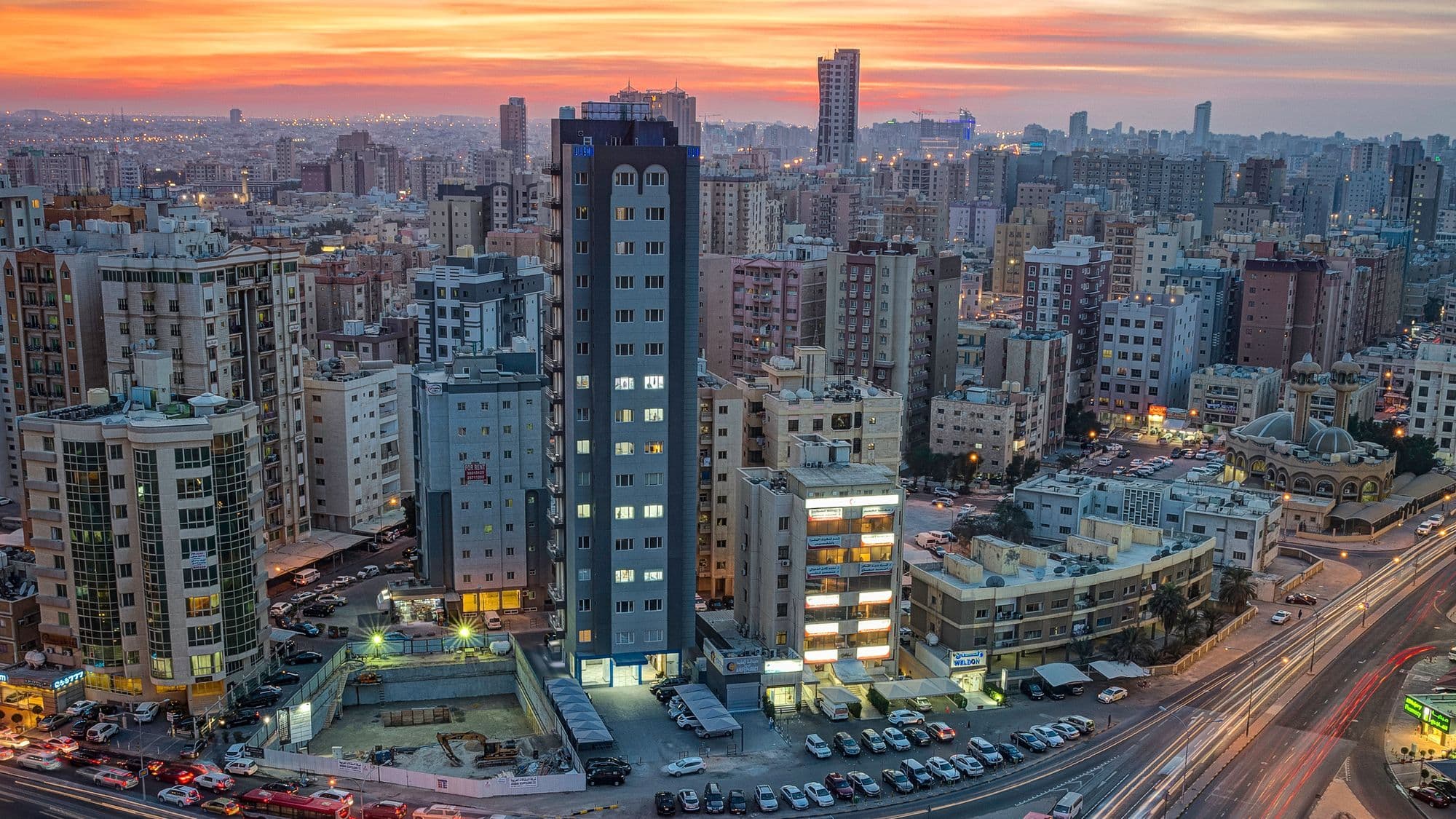Salmiya business district representing coordinated Gulf company resources