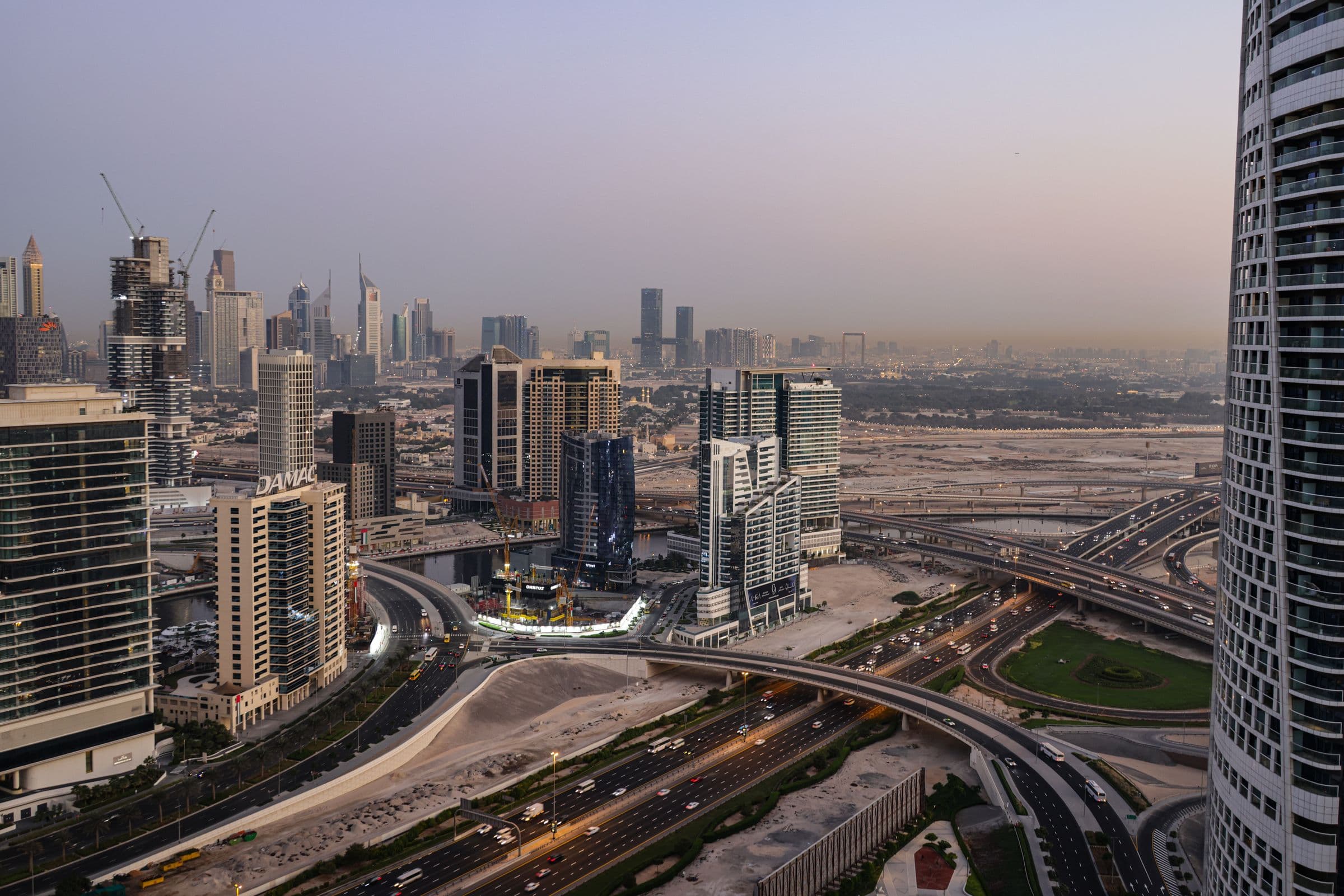 Dubai business skyline illustrating free zone versus mainland website requirements