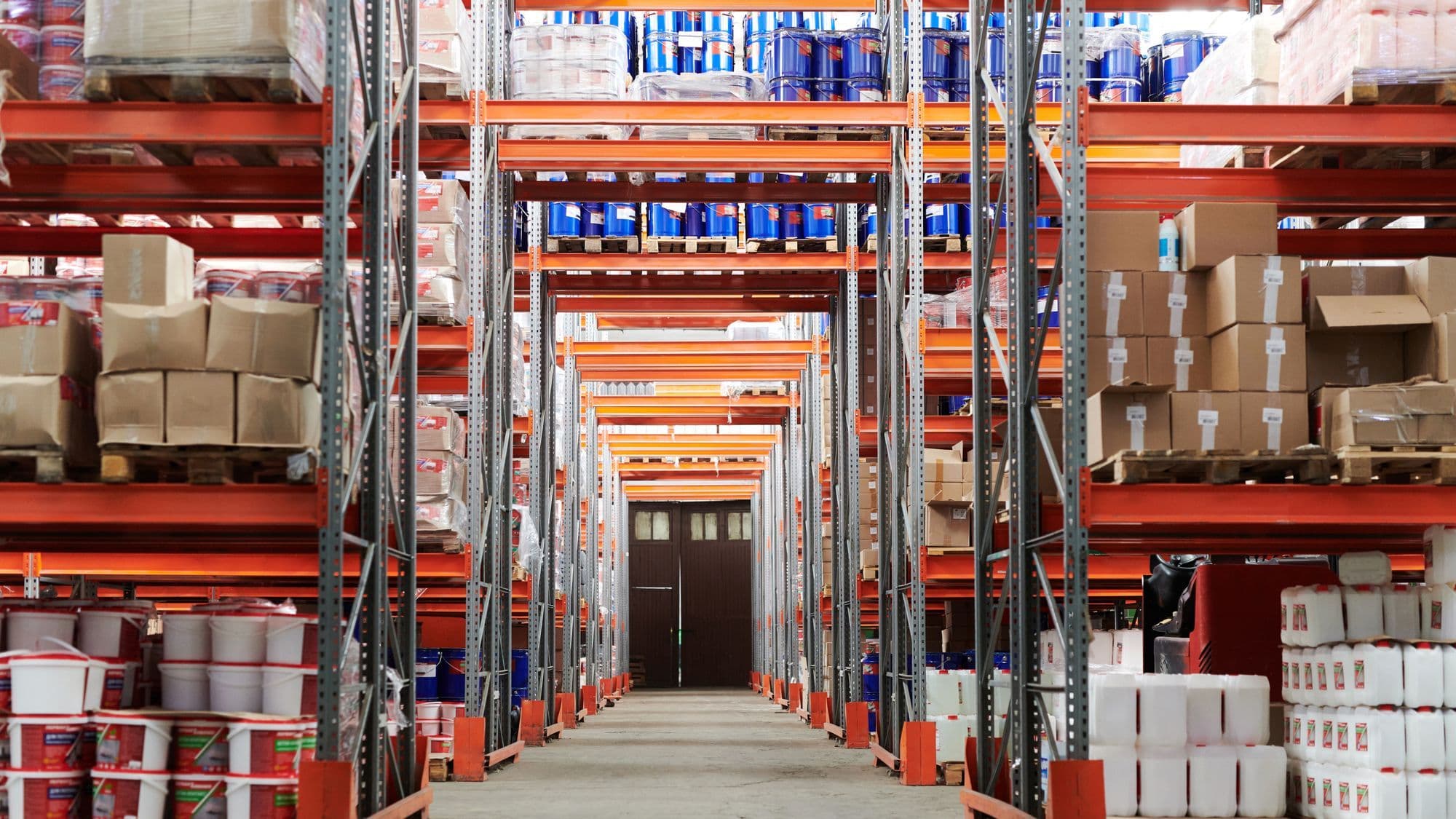 Organized warehouse aisle representing branch and central stock