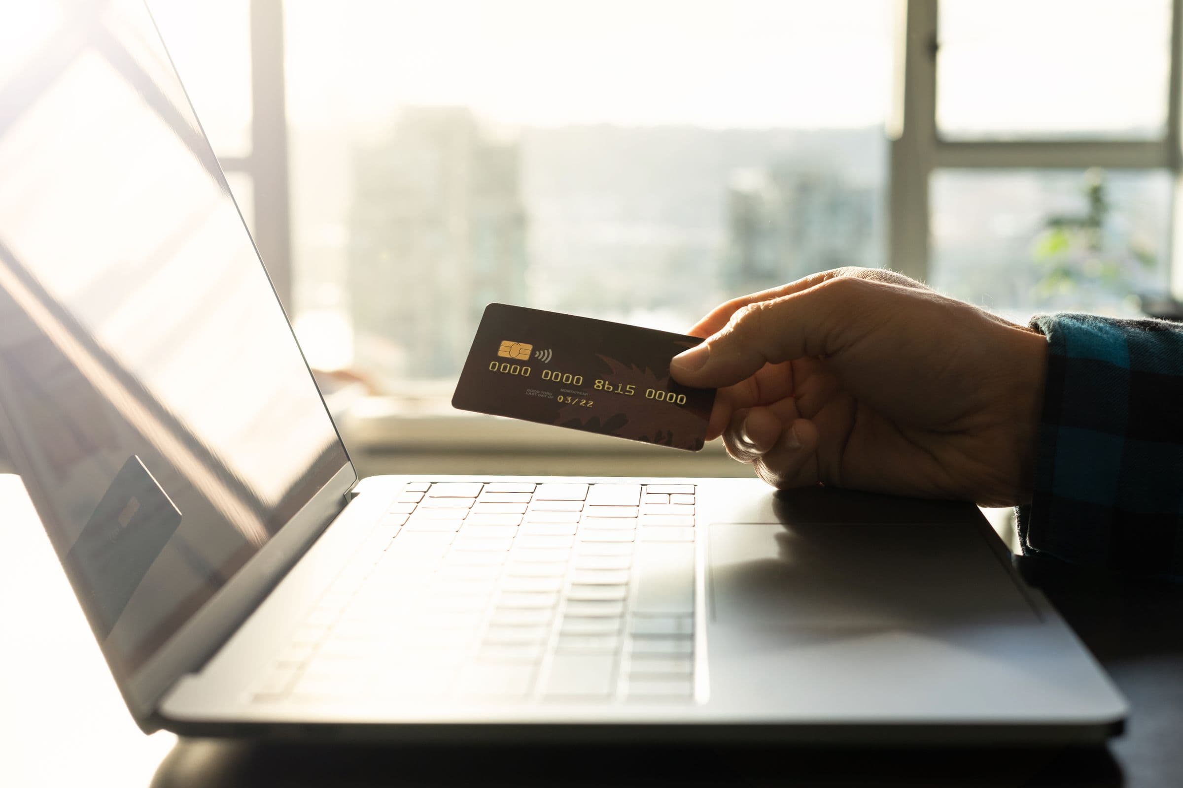 Phone and laptop showing digital payment for a Saudi online store