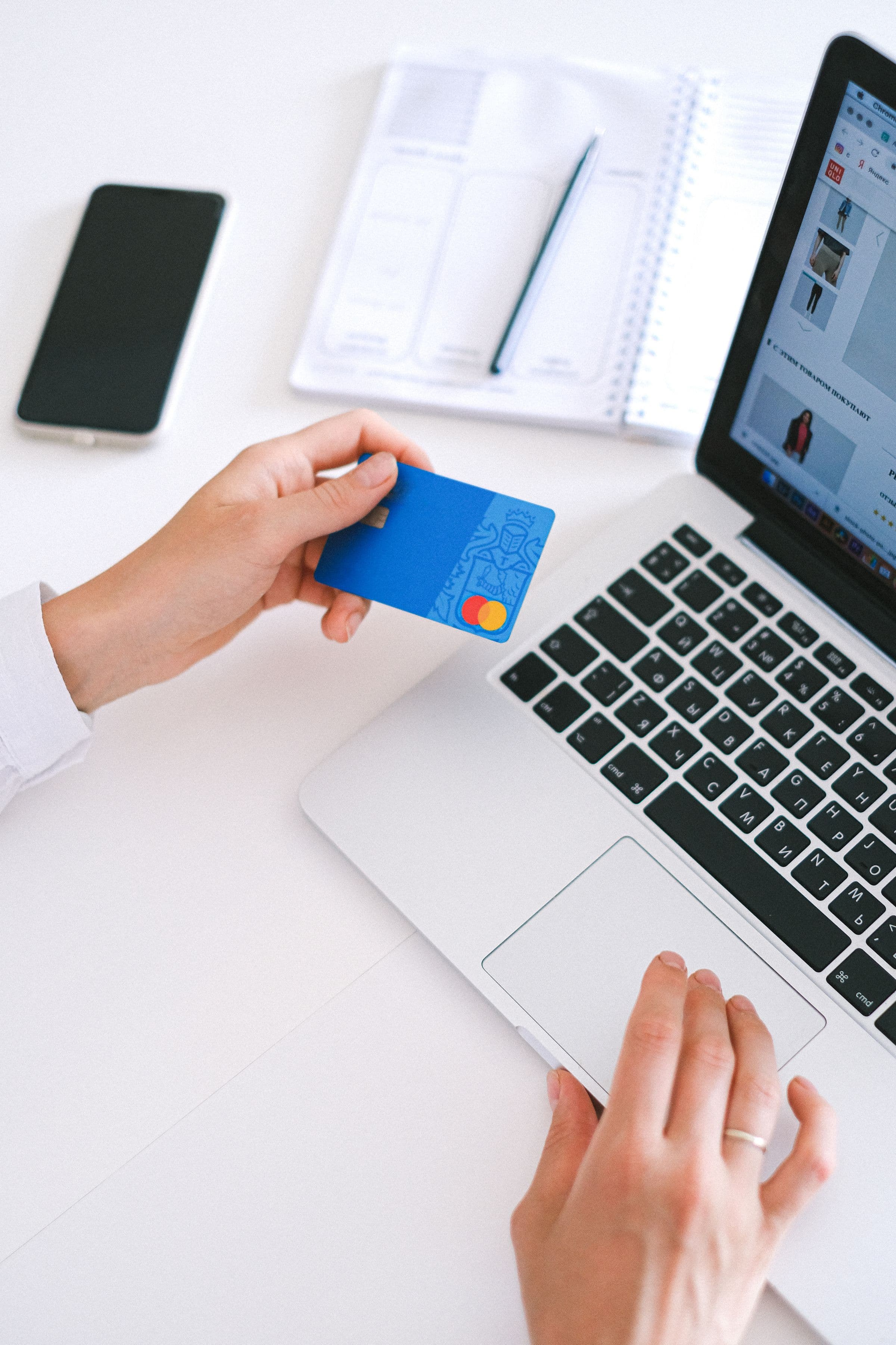 Phone and laptop showing digital payment for a Saudi online store