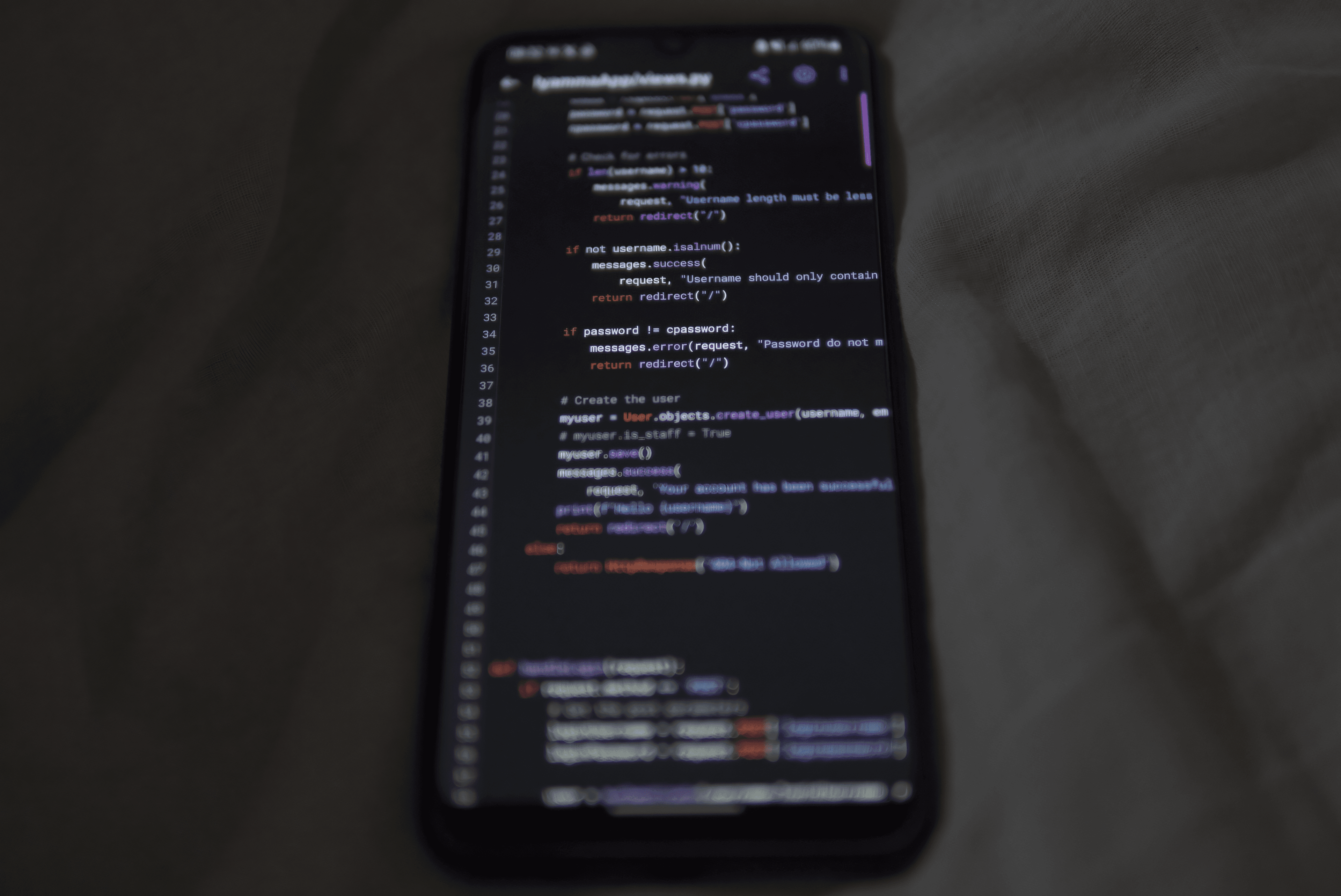 Smartphone displaying code for a mobile app technology decision