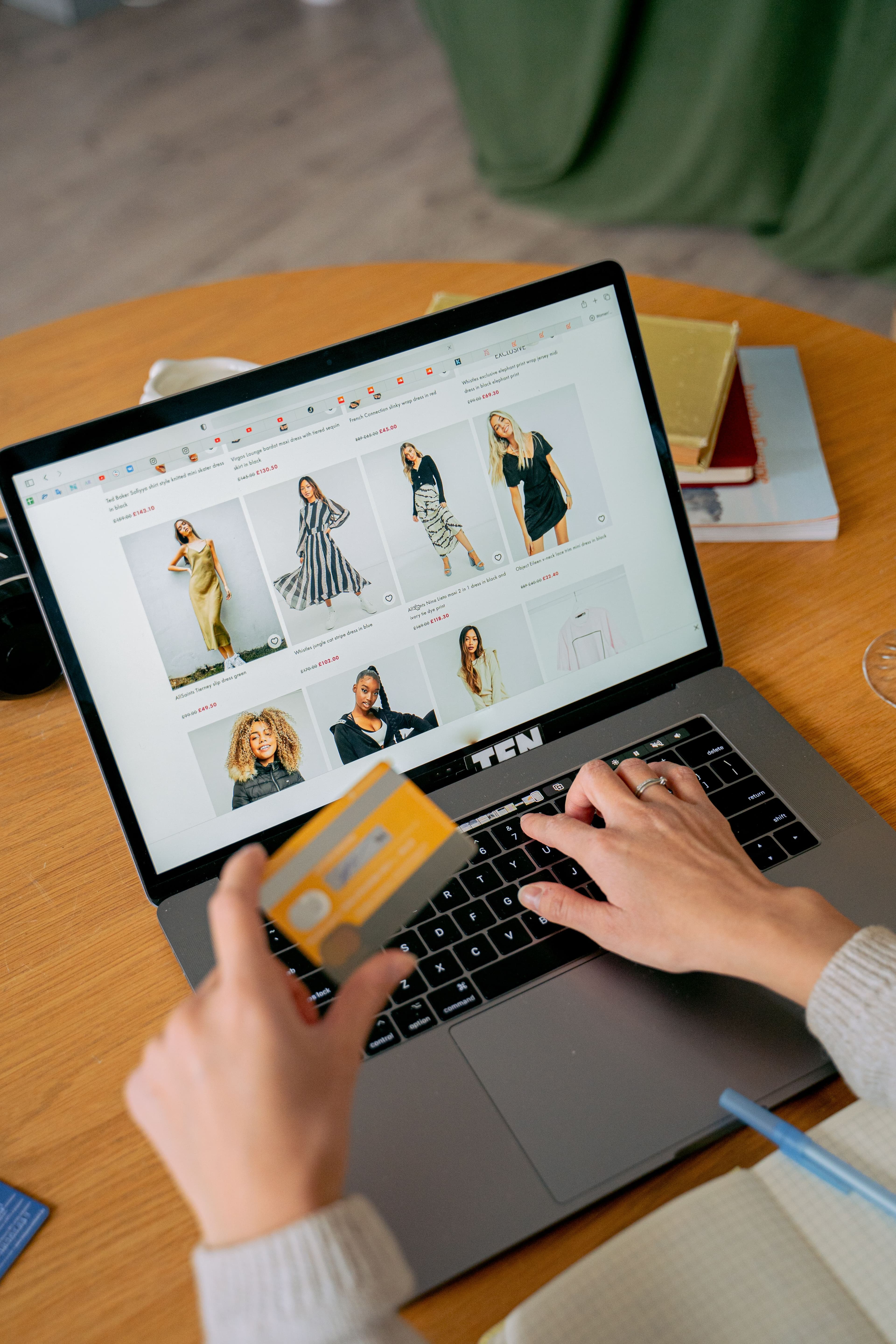 Store owner comparing e-commerce platforms on a laptop