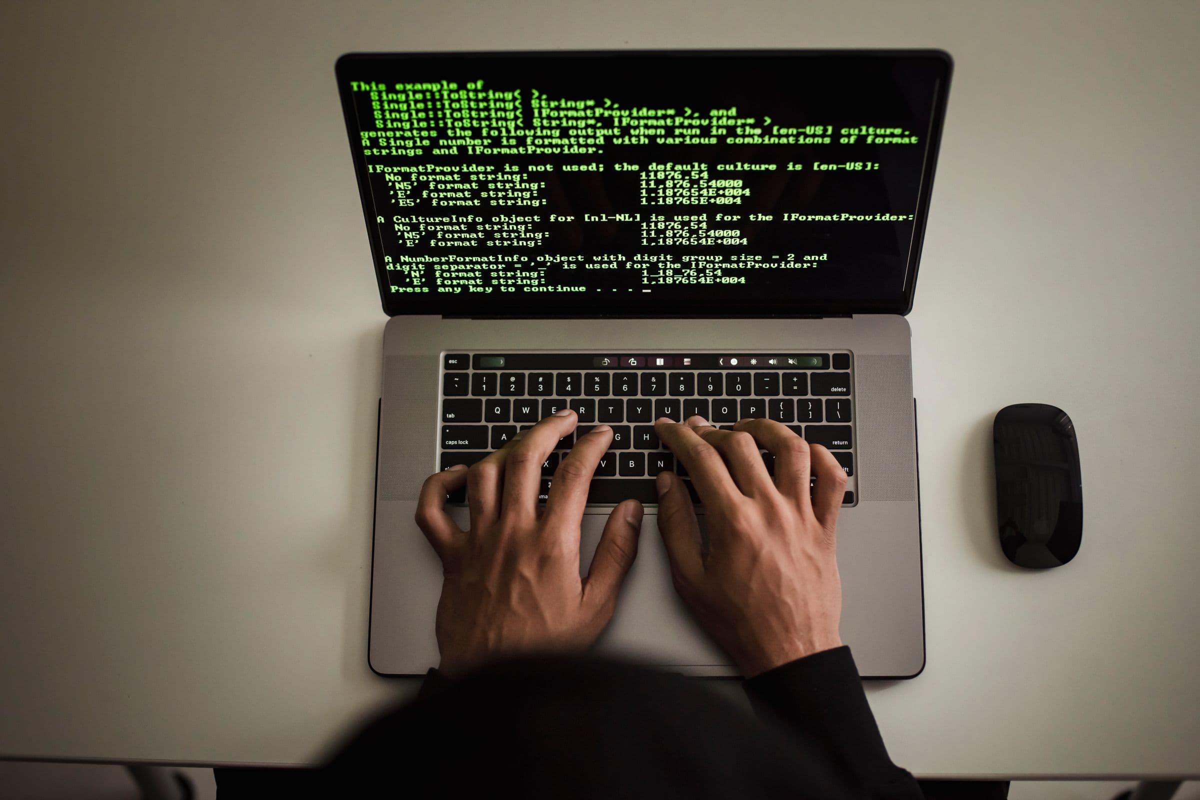 Website source code displayed on a developer laptop