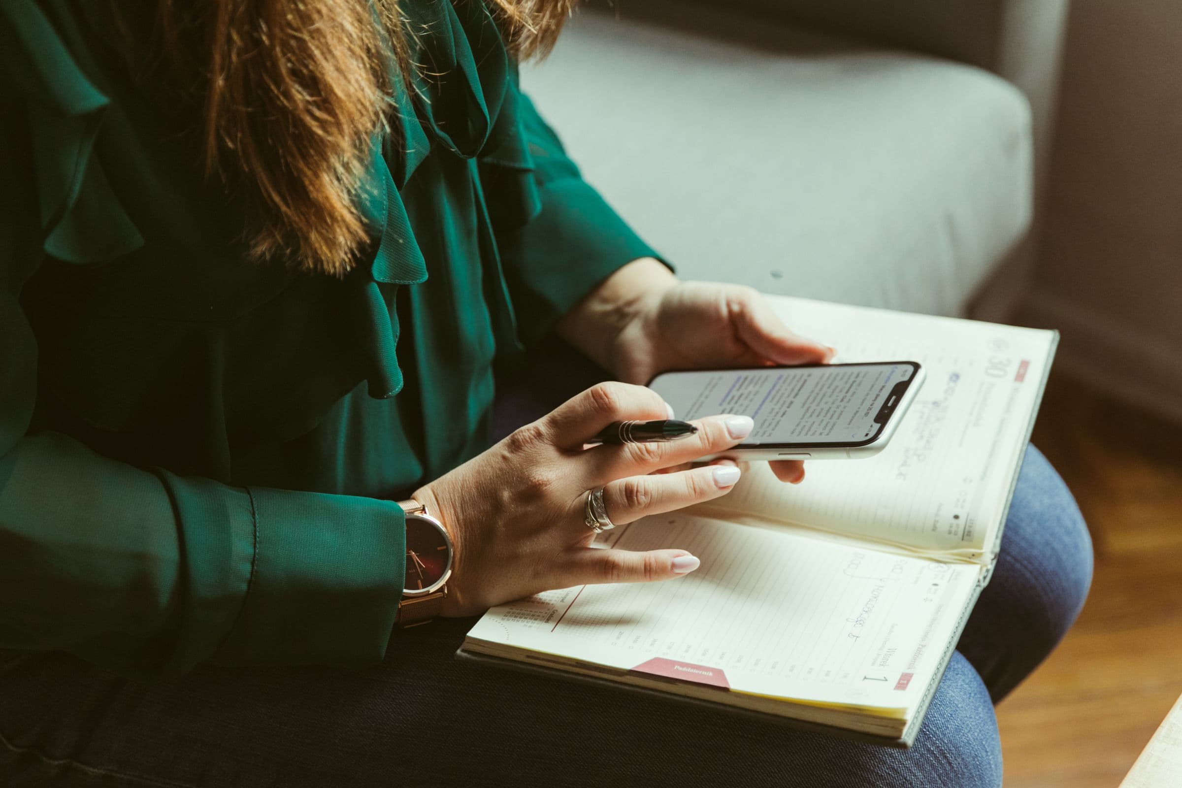 Small business owner using a phone to manage Instagram sales in the UAE