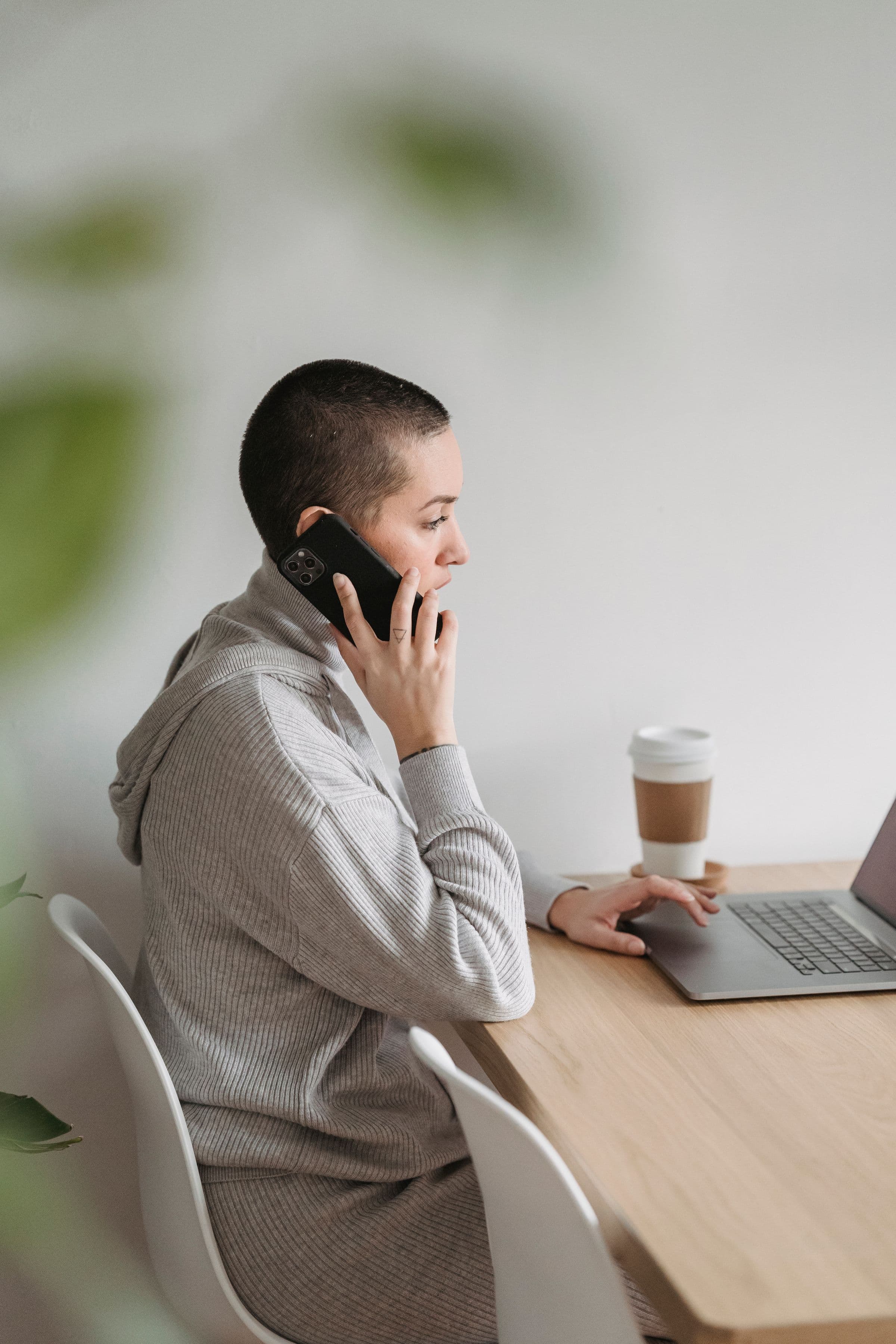 Small business owner using a phone to manage Instagram sales in the UAE