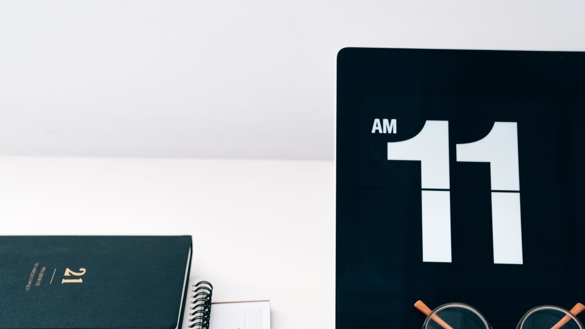 Laptop, calendar, and desk tools for planning website delivery weeks