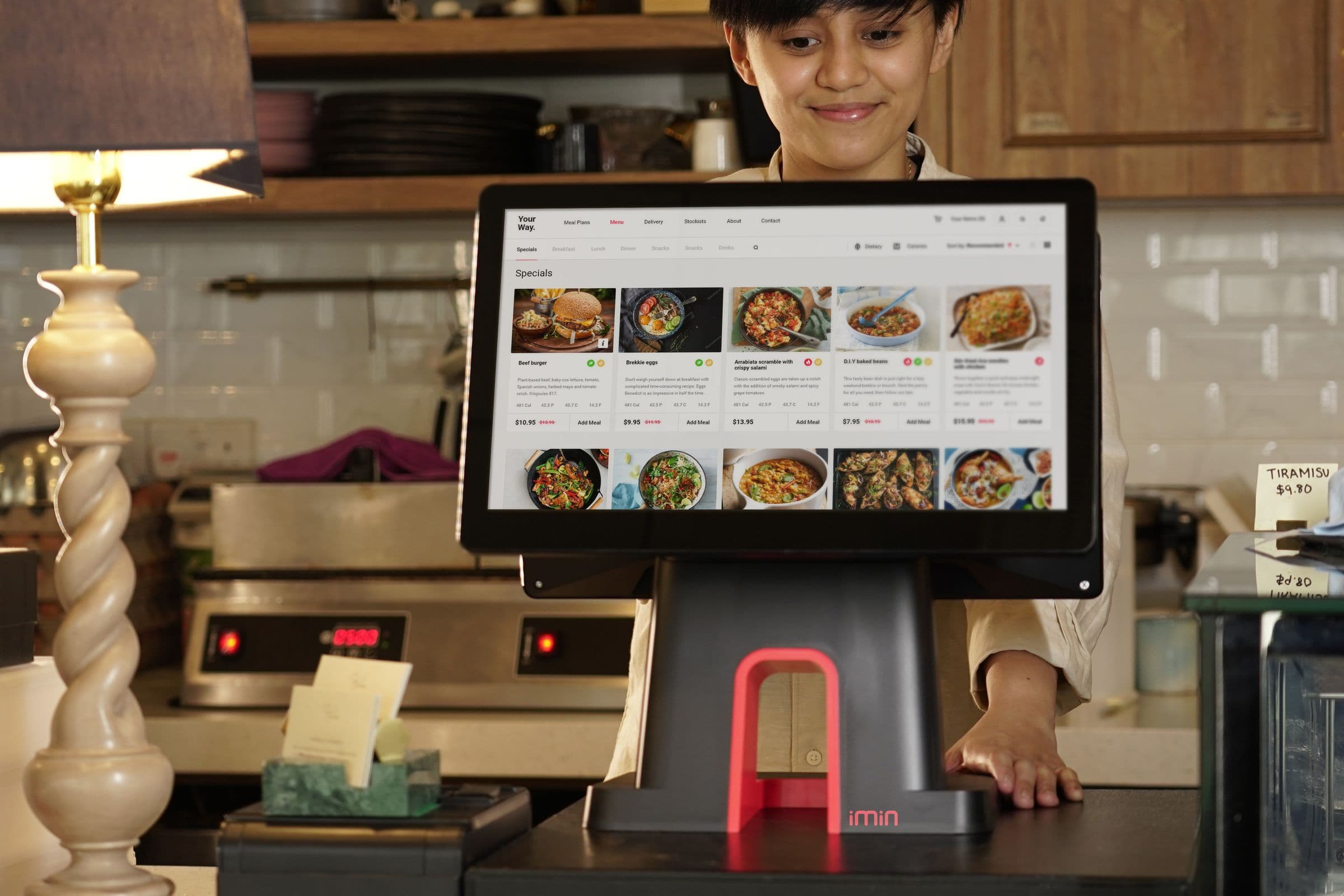 Arab shoppers using digital payment at a point of sale in a Gulf retail store
