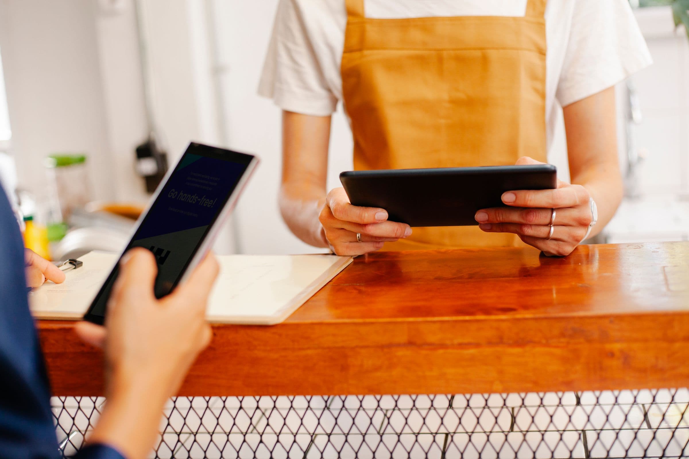 Arab shoppers using digital payment at a point of sale in a Gulf retail store
