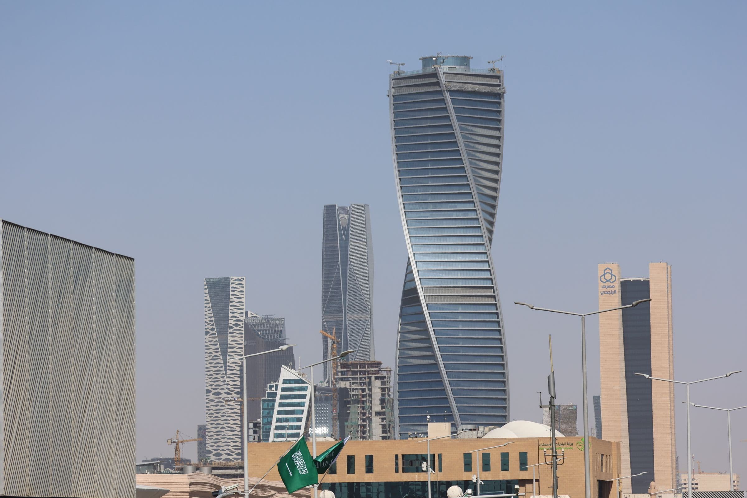 Modern Riyadh skyline and Saudi flags for choosing the best software company in Riyadh