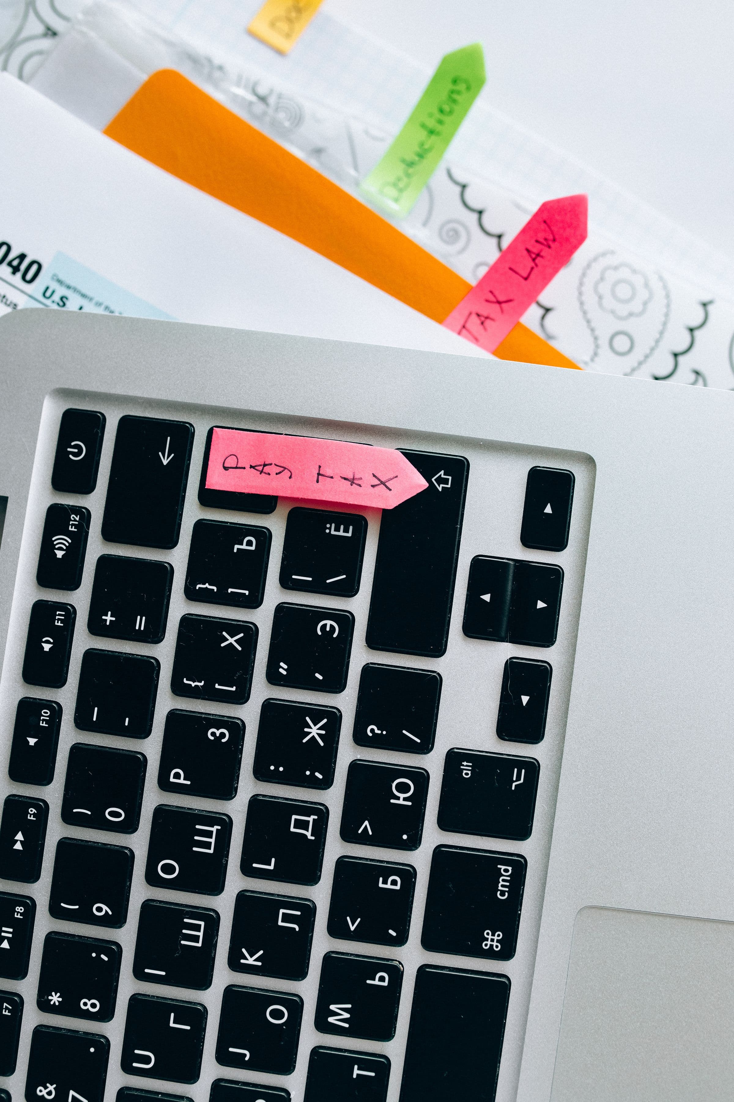 Tax documents beside a system preparing for electronic invoicing
