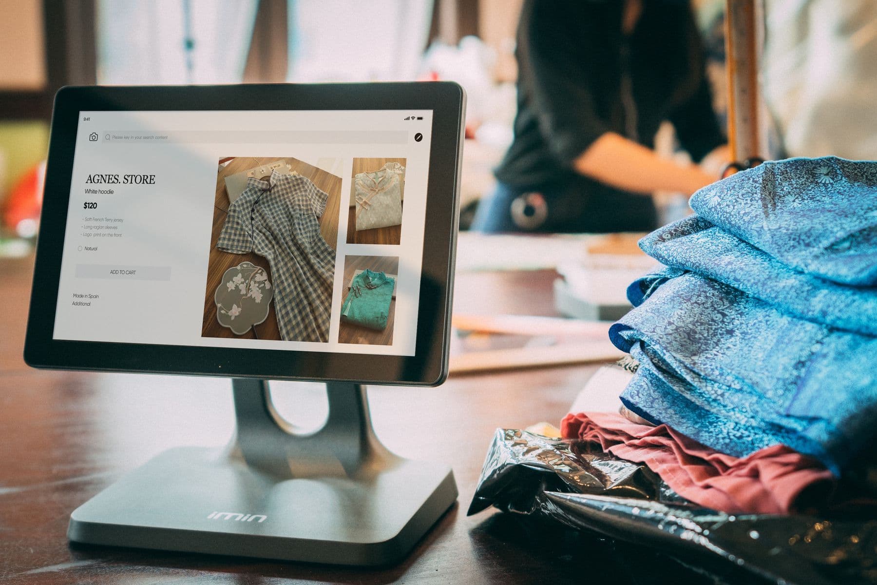 Online store owner managing orders on a tablet